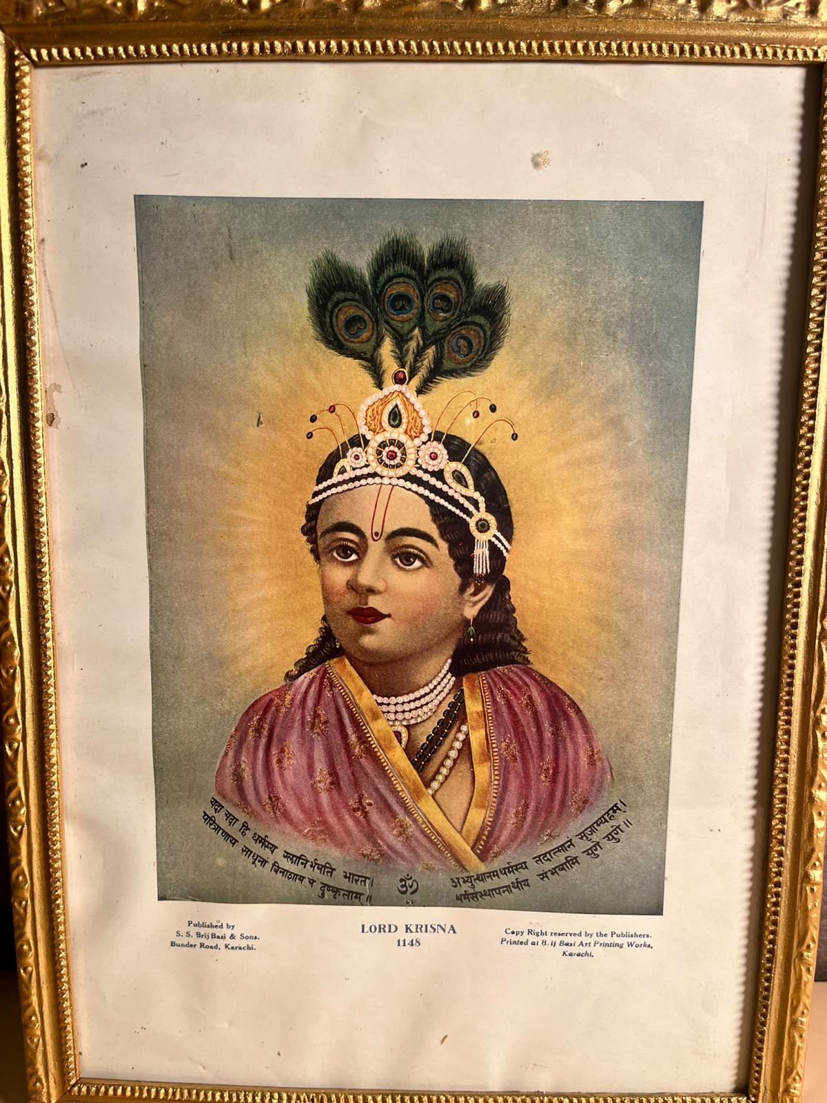 Vintage “Lord Krisna” Devotional Portrait Print – S. S. Brij Basi & Sons, Karachi | 10 × 14 Inches